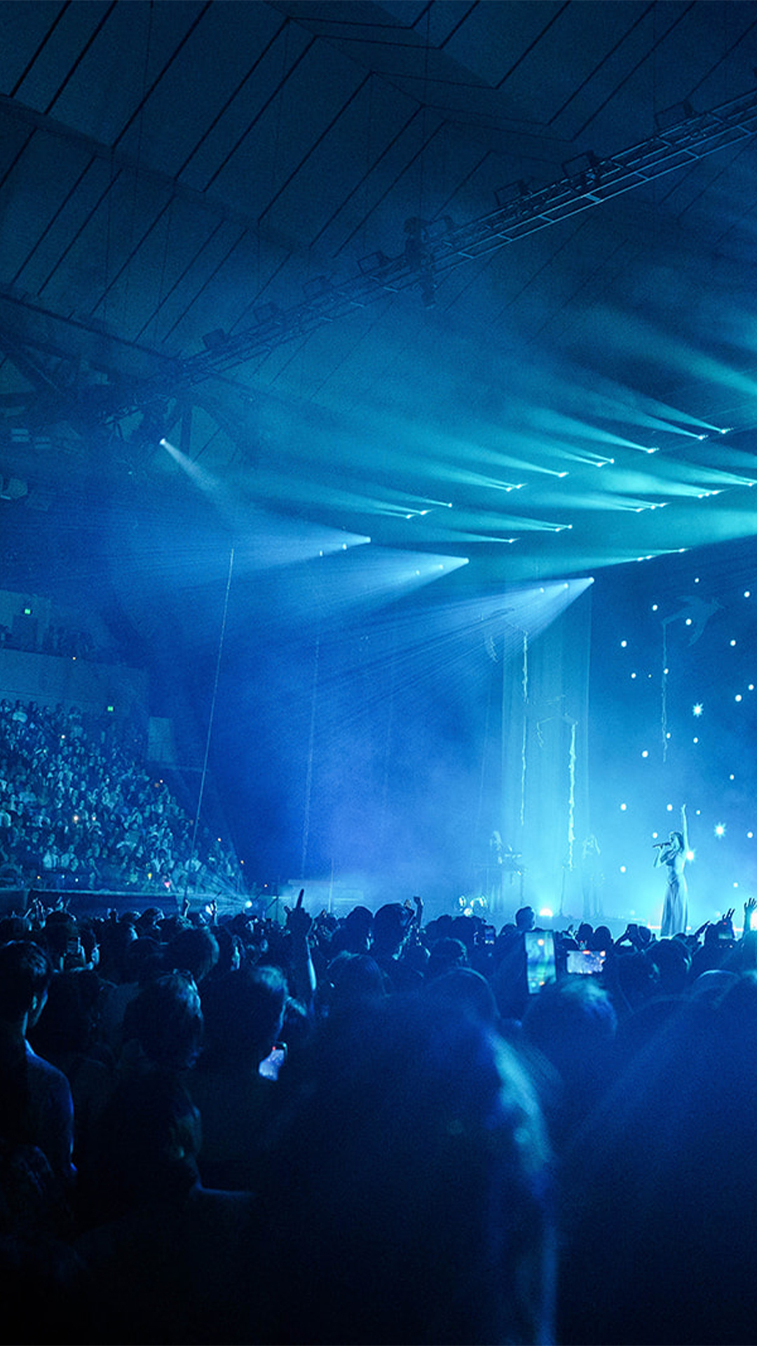 A packed crowd enjoying a concert at Margaret Court Arena.